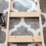 Putting-together-a-blanket-ladder-that-cost-less-than-five-dollars-in-lumber