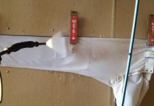 Pressure washing dirty sports equipment to make it look like new