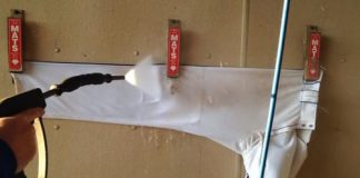 Pressure washing dirty sports equipment to make it look like new