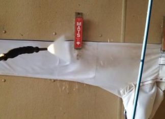 Pressure washing dirty sports equipment to make it look like new