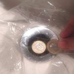 Why he placed a bag over the drain of his hotel bathtub.