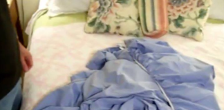 This is a fitted sheet – wait until you see how he folded it so neatly!