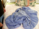 This is a fitted sheet – wait until you see how he folded it so neatly!