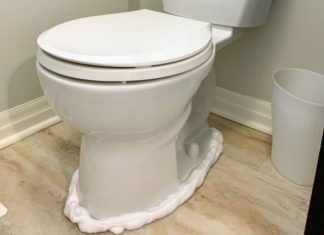 A lady sprays shaving cream around the toilet bowl for this great reason
