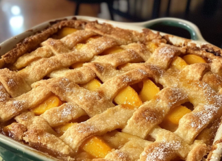 Sweet and Steamy: Hot Peach Cobbler Fresh from the Oven – A Timeless Treat!