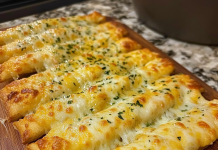 Delight in the Flavor: Homemade Cheesy Garlic Breadsticks That Will Steal the Show!