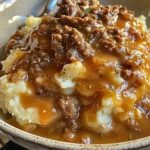 Mashed potatoes with ground beef gravy