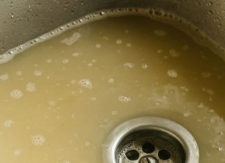 My kitchen sink takes forever to drain, and I’m hosting dinner soon — what can I safely try first?