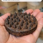 Clearing out the attic and found this heavy metal base covered in sharp spikes. It’s rusted and looks dangerous. What is this?