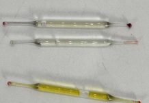 What’s this? Found under a bathroom vanity during remodeling—small glass tubes, 2 inches long, filled with liquid. Any ideas?