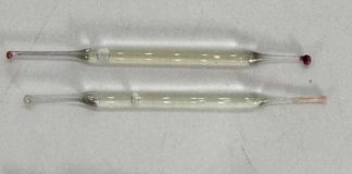 What’s this? Found under a bathroom vanity during remodeling—small glass tubes, 2 inches long, filled with liquid. Any ideas?