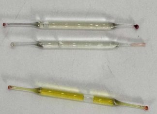 What’s this? Found under a bathroom vanity during remodeling—small glass tubes, 2 inches long, filled with liquid. Any ideas?