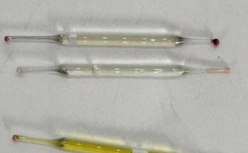 What’s this? Found under a bathroom vanity during remodeling—small glass tubes, 2 inches long, filled with liquid. Any ideas?