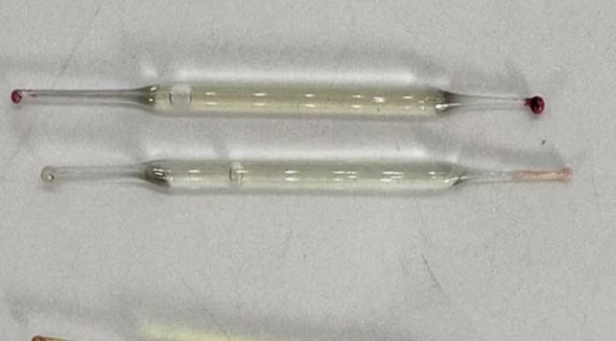 What’s this? Found under a bathroom vanity during remodeling—small glass tubes, 2 inches long, filled with liquid. Any ideas?
