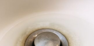 My bathroom sink has been draining slower by the day, and plumbers are fully booked until after Christmas. What can I try first?