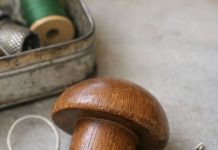 Found this smooth wooden object in an old sewing tin. Shaped like a mushroom but the handle is too short to be a pestle.