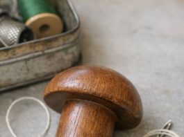 Found this smooth wooden object in an old sewing tin. Shaped like a mushroom but the handle is too short to be a pestle.