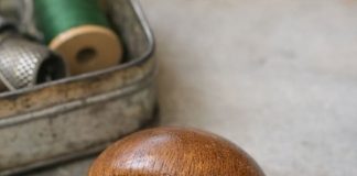 Found this smooth wooden object in an old sewing tin. Shaped like a mushroom but the handle is too short to be a pestle.