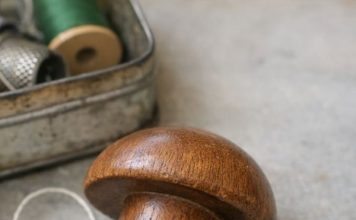 Found this smooth wooden object in an old sewing tin. Shaped like a mushroom but the handle is too short to be a pestle.