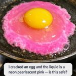 I cracked an egg and the liquid is a neon pearlescent pink — is this safe?