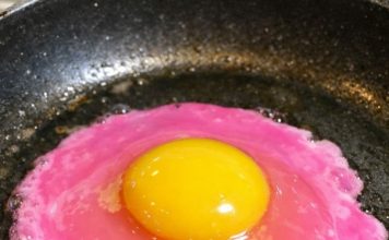 I cracked an egg and the liquid is a neon pearlescent pink — is this safe?
