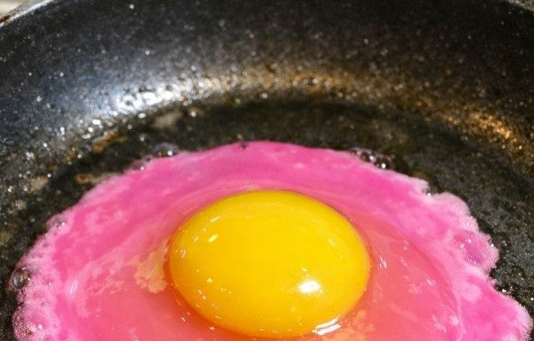 I cracked an egg and the liquid is a neon pearlescent pink — is this safe?