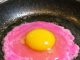 I cracked an egg and the liquid is a neon pearlescent pink — is this safe?