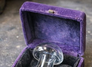 Found this glass mushroom thing in a velvet-lined box at an estate sale. It has a metal connector at the bottom. Looks like part of a machine?