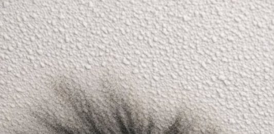 I keep cleaning these dark smudges around my air vent, but they keep coming back. It looks like soot or maybe black mold spreading across the ceiling. It’s the only vent in the house doing this. Is