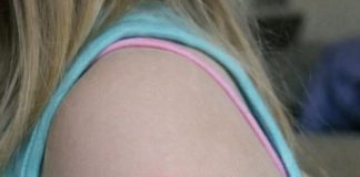 My daughter woke up with this strange red ring on her arm. It’s not itchy but looks spreading. I’m panicking, do I need to rush her in?