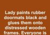 Lady paints rubber doormats black and glues them onto distressed wooden frames. Everyone is copying this idea for their patio.