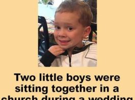 Two little boys were at sitting together in a church