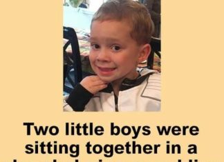 Two little boys were at sitting together in a church