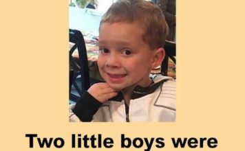 Two little boys were at sitting together in a church