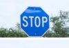 We saw a blue stop sign yesterday. Our neighbor said it means something different—any idea what that is?