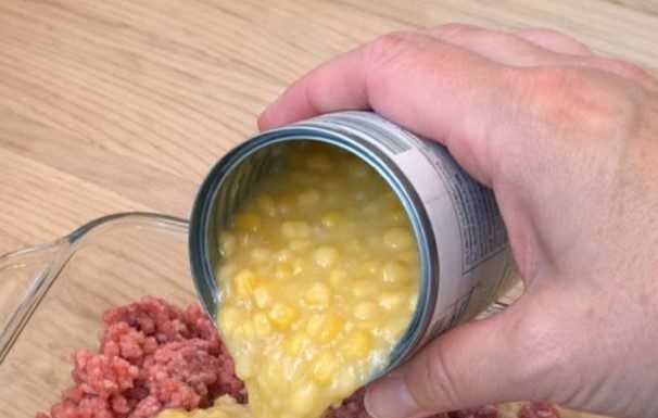 Pour Canned Creamed Corn Over Raw Crumbled Ground Beef, Combined With 3 Ingredients, Into a Glass Baking Dish for a Hearty Dinner That’s My Default